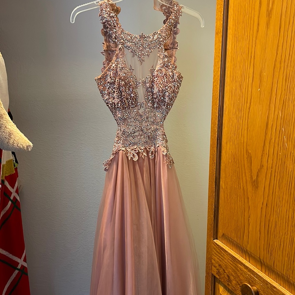 This is a beautiful rose gold prom dress, and is in great condition